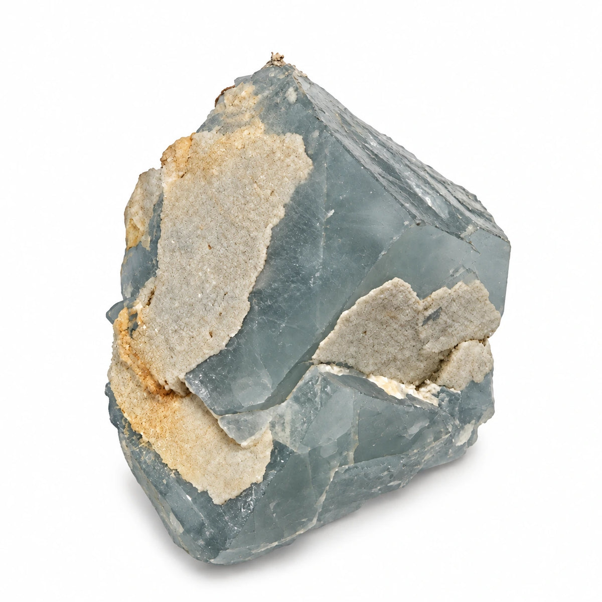 Cristal brut de fluorite bleu grisé de Marsanges à Langeac, partiellement recouvert de microcristaux de quartz crème