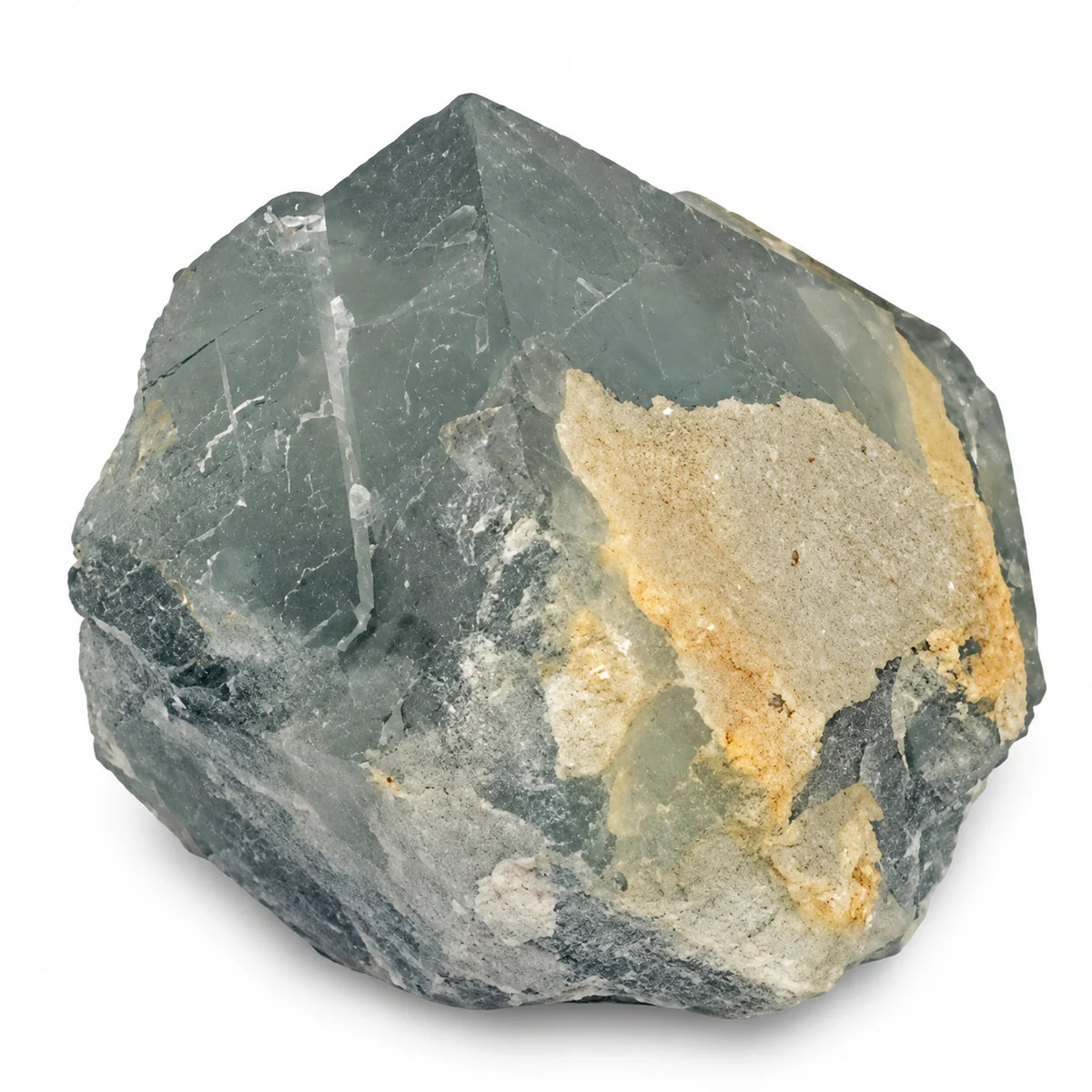 Cristal brut de fluorite bleue de Langeac, montrant les surfaces planes et les dépôts clairs de quartz