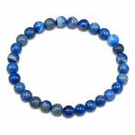Bracelet en véritable lapis lazuli, perles rondes naturelles de 6 mm, pierre bleue authentique aux nuances variées, présenté sur fond blanc pour bijou en pierre naturelle.